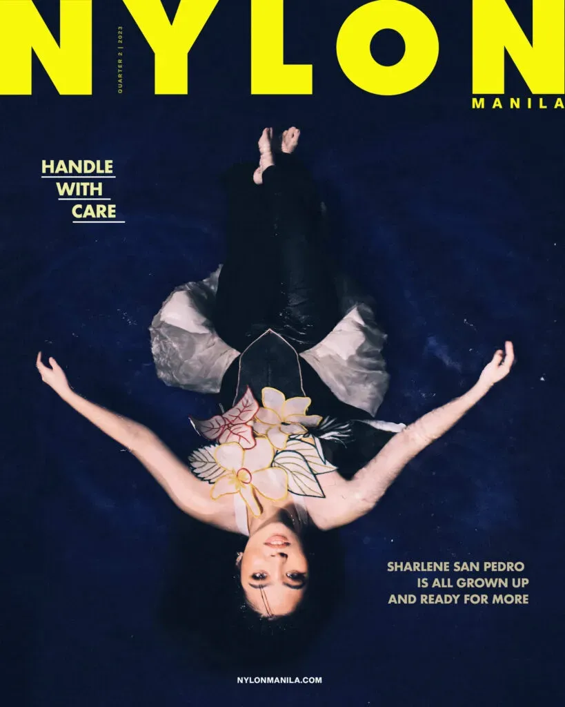 Magazine cover with the large yellow masthead “NYLON MANILA” above a person posing upside-down, with cover lines including “HANDLE WITH CARE.”