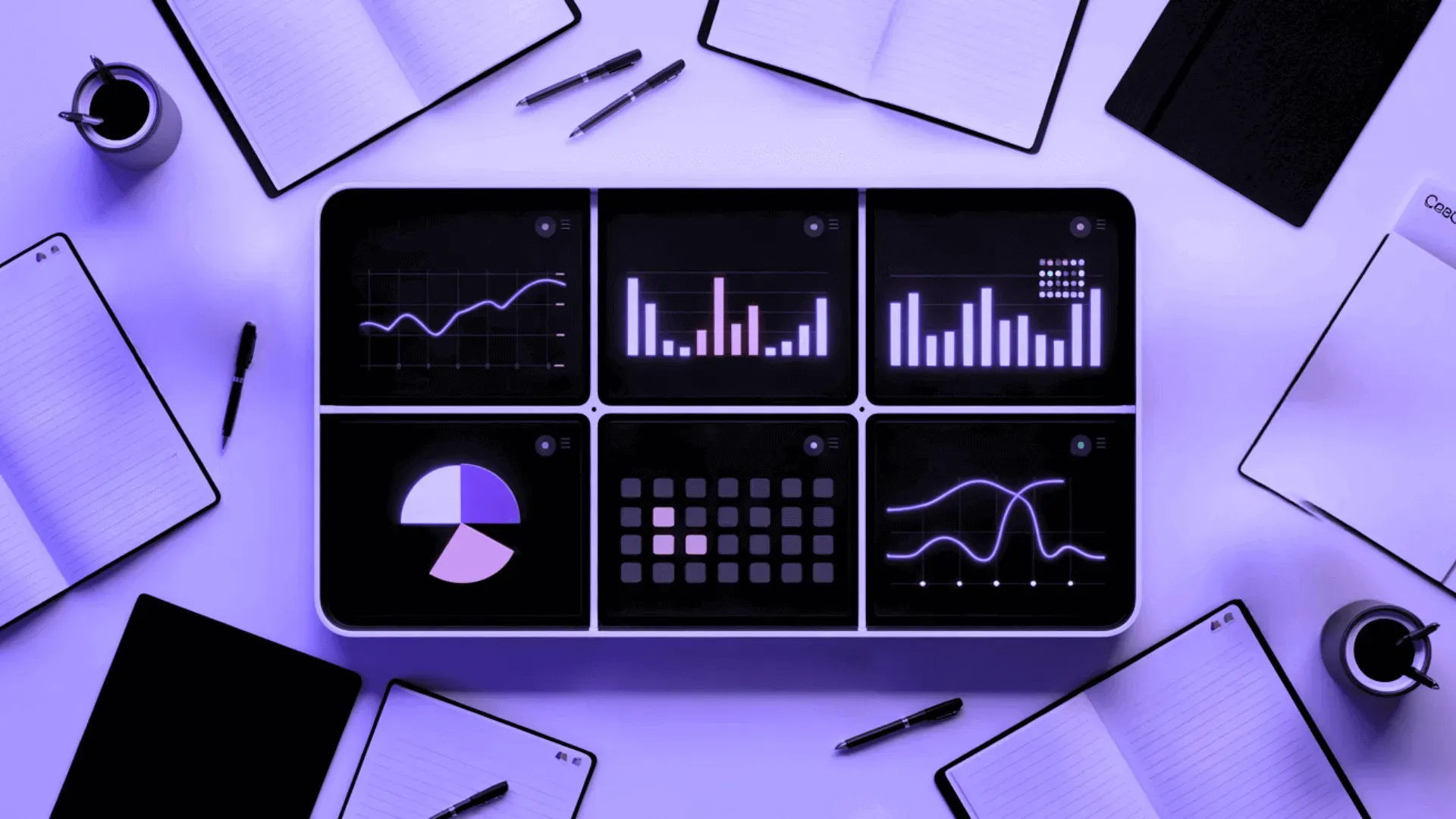 A monitor showing a media dashboard with bar charts, a donut chart, and a line graph amid floating document cards on a purple background.