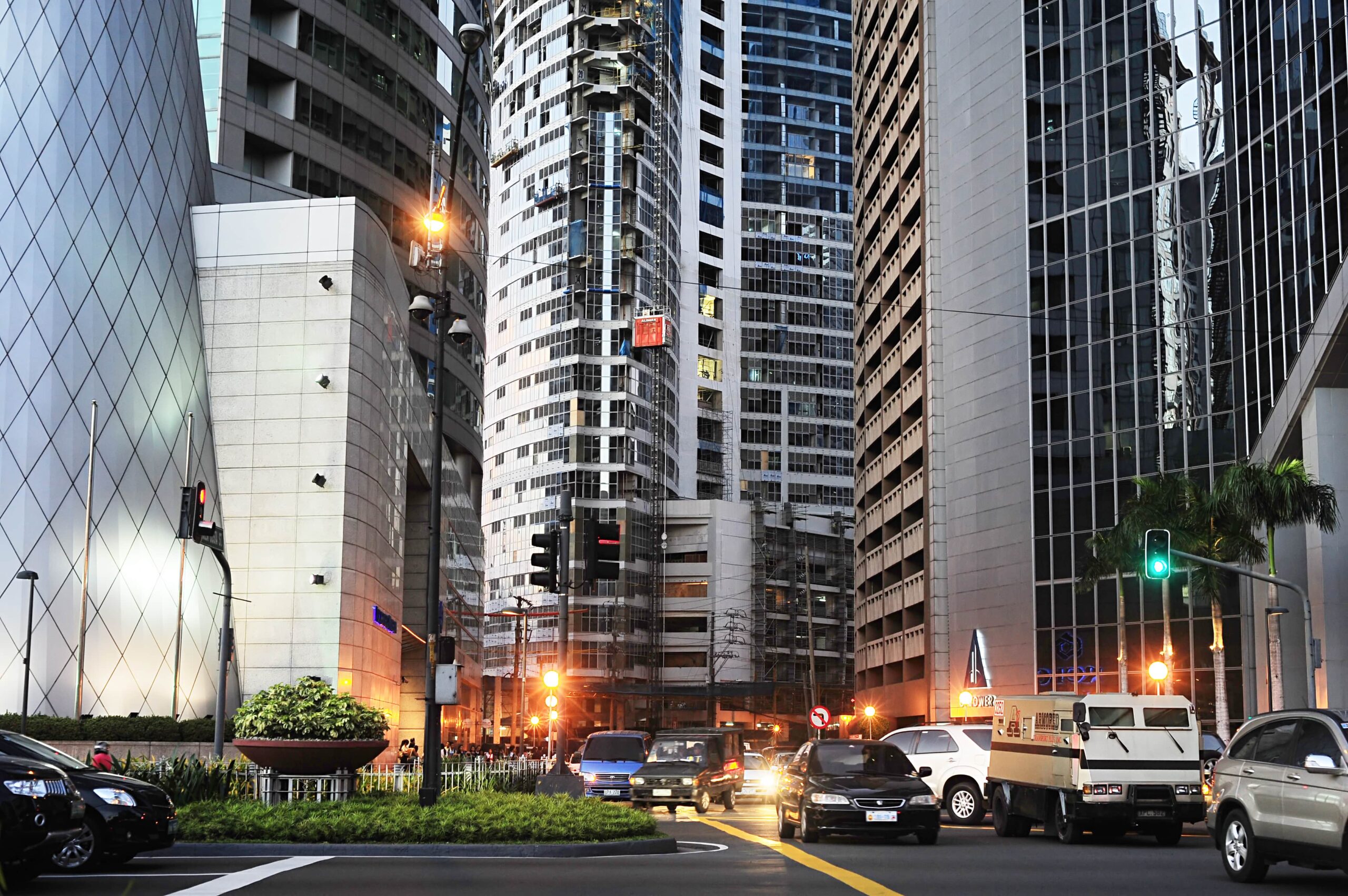 Photo of a city avenue lined with high-rise buildings in a business district.